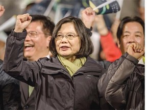 File: Tsai Ing-wen (C), waves to supporters at DPP headquarters after her election victory on January 16, 2016 in Taipei, Taiwan. Tsai Ing-wen, the chairwoman of the opposition Democratic Progressive Party, has won the presidential election to become the Taiwan’s first female president.
