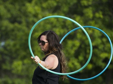 Christina Norberg spins hoops at the main stage at the 39th annual Folk Music festival Jericho Beach Vancouver, July 15 2016.