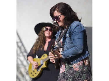 Jolie Holland ( L ) and Samantha Parton ( R ) performs on the main stage at the 39th annual Folk Music festival Jericho Beach Vancouver, July 15 2016.