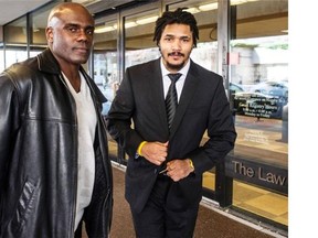 Former CFL players Arland Bruce (right) and Larry Thompson outside B.C. Supreme Court in Vancouver on Feb. 23, 2016.