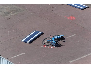 This picture taken on July 15, 2016, shows a a velo bleu (Nice's self-service bicycles) left behind on the site where a truck drove into a crowd watching a fireworks display on the Promenade des Anglais seafront in the French Riviera town of Nice on July 15, 2016. An attack in Nice where a man rammed a truck into a crowd of people left 84 dead and another 18 in a "critical condition", interior ministry spokesman Pierre-Henry Brandet said Friday. An unidentified gunman barrelled the truck two kilometres (1.3 miles) through a crowd that had been enjoying a fireworks display for France's national day before being shot dead by police.