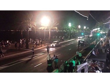 An image grab obtained from the Twitter account of harp_detectives, shows people running away from the scene of an attack in the French Riviera city of Nice during Bastille Day on July 14, 2016. A gunman smashed a truck into a crowd of revellers celebrating Bastille Day in the French Riviera city of Nice, killing at least 84 people in what President Francois Hollande on Friday called a "terrorist" attack. Police shot the driver dead after he drove the truck two kilometres (1,3 miles) through a crowd that had been enjoying a fireworks display on France's July 14 national holiday.