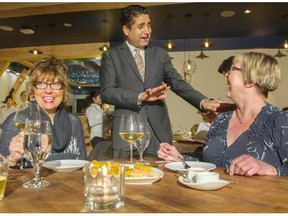 Kamal Mroke greets customers, from left, Joan Rosentreter and Shirley Sidey at Swad in West Vancouver.