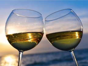 Glasses of white wine against sunset, for Salut summer 2015. Fotalia pic. [PNG Merlin Archive]