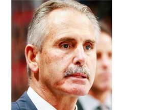 Head coach Willie Desjardins of the Vancouver Canucks looks on from the bench during their NHL game against the Montreal Canadiens at Rogers Arena October 27, 2015 in Vancouver, British Columbia, Canada.