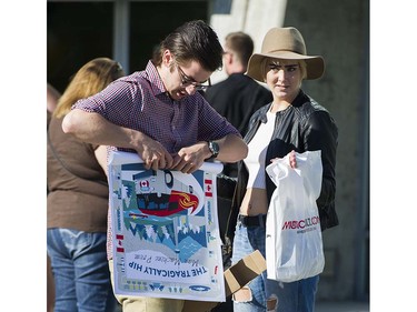 Fans gather before the concert and purchase merchandise prior to attending the first concert of the Tragically Hip's final tour at the Save On Foods Memorial Centre, Victoria, July 22 2016.