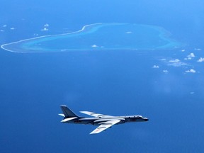 A Chinese H-6K bomber patrols islands and reefs in the South China Sea.