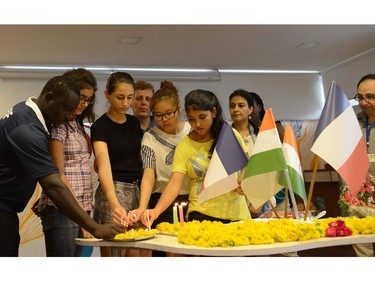 Indian students take part in a prayer meeting in memory of the victims of a truck attack in the French city of Nice at the Mahatma Gandhi International School (MGIS) in Ahmedabad on July 15, 2016.  French President Francois Hollande said July 15 that "many foreigners and young children" were among those killed or injured after the truck attack on a crowd celebrating Bastille Day in Nice, with around 50 fighting for their lives. At least 84 people were killed after a lorry ploughed into crowds celebrating Bastille Day in Nice.