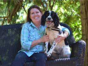 Superbug survivor Teresa Zurberg with her dog Angus, a two-year old English springer spaniel who will be working at Vancouver General Hospital as the world's only C. diff. sniffing canine.