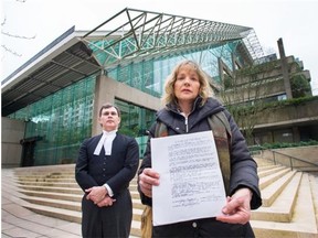 Katherine Hammond, daughter of Margot Bentley (holding Bentley’s 1991 living will), and lawyer Kieran Bridge, outside the B.C. Court of Appeal last year.