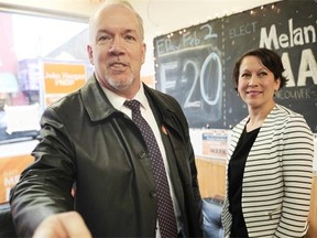 NDP leader John Horgan, here with NDP MLA Melanie Mark, has introduced two bills to the legislature to tackle the housign affordability crisis.
