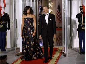 First Lady Michelle Obama, wearing a Jason Wu gown, and President Barack Obama arrive at the North Portico of the White House on March 10, 2016.