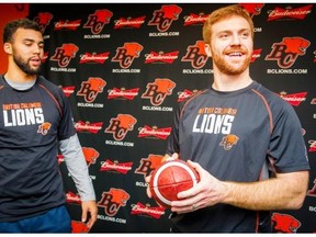 B.C. Lions GM-coach Wally Buono says he wants veteran quarterback Travis Lulay (right) to grab the ball and compete with the established starter, Jonathon Jennings (left) at training camp and beyond.