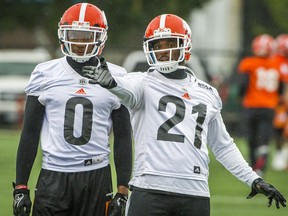 BC Lions Ryan Phillips, right chats with Loucheiz Purifoy, left during the team's practice in Surrey.