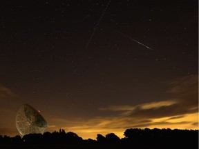 A Perseid meteor streaks across the sky over the Lovell Radio Telescope at Jodrell Bank in England in August 2013. Astronomers expect 2016 to be a very good year for meteor sightings.