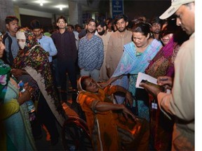 Pakistani relatives of injured victims gather outside the hospital in Lahore. (ARIF ALI/AFP/Getty Images)