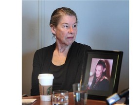 Judy Graves with a photo of Anita Hauck at a news conference presented by Megaphone, a homeless advocacy group in Vancouver, BC., March 29, 2016.