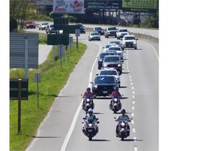 A motorcade escorts the body of RCMP Const. Sarah Beckett on Thursday, April 7, 2016.