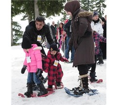 Some of the approximately 350 Syrian refugees enjoy what is for some of them their first snow experience at Mt. Seymour in North Vancouver, BC., April 3, 2016.