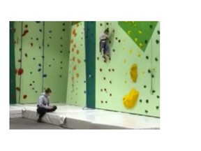 Funtopia Surrey says this woman has been fired after a video showed a child being ignored while stuck up a climbing wall. The woman appears to have been on her cell phone the whole time.