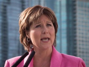 British Columbia Premier Christy Clark pledges to crack down on "shady" realtors involved in shadow flipping in the hot property market, in Vancouver, B.C., on Friday March 18, 2016.