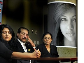 Maple Batalia (in framed photo) was murdered at SFUs Surrey campus in 2011.l-r);sister Roseleen, father Harkirat and mother Sarbjit and  wipe away tears as Surrey RCMP announce they have charged one man with first degree murder and another with manslaughter at Surrey RCMP Headquarters on Saturday December 01, 2012.