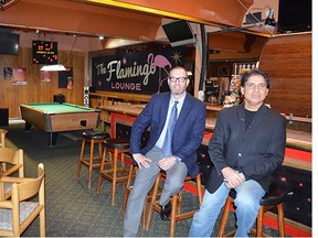 Mark Aylott, general manager of Whalley's Flamingo Hotel (left) and Surrey land developer Charan Sethi, of the Tien Sher Group, sit inside the hotel's lounge.