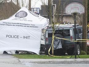 RCMP and Integrated Homicide Investigation Team investigate a suspicious death Saturday morning March 12, 2016 in the 7900-block 123A St. in Surrey, BC. A vehicle crashed into a front yard Friday night. One person who was taken to hospital has since died.