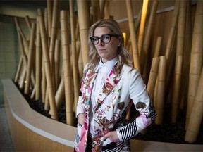 Former WestJet flight attendant Mandalena Lewis stands for a photograph in Vancouver, B.C., on Tuesday March 8, 2016.