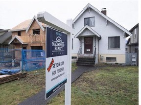 A sold home is pictured in Vancouver, B.C., Thursday, Feb. 11, 2016. Prospective buyers and neighbours have long complained that investors are buying houses and leaving them empty, driving up prices and reducing supply, but there's been little data to back up the claims. Vancouver hired software company Ecotagious Inc. last year to analyze electricity consumption, and its CEO is expected to present a report on its findings to city council Tuesday.