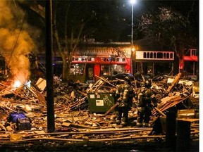 Firefighters work at the scene of a building explosion in Seattle's Greenwood neighborhood early Wednesday, March 9, 2016. (Genna Martin/seattlepi.com via AP) MAGS OUT; NO SALES; SEATTLE TIMES OUT; TV OUT; MANDATORY CREDIT