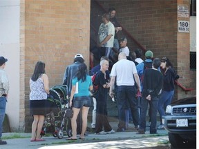 People line up to get their welfare cheques  in Vancouver. People on social assistance are judged as frivolous and immoral for making ethical purchases such as organic food, while the rich are considered virtuous for the same choices, new research shows.