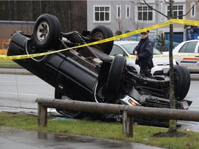 In this file photo, Surrey RCMP attend to an overturned Toyota pickup truck that was involved in a carjacking and crashes in the area of 68th Avenue and Fraser Highway in Surrey on Dec. 23, 2014.