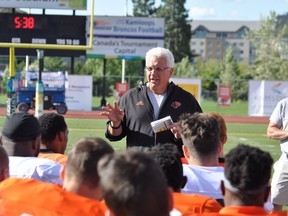 Wally Buono holds court for his players during B.C. Lions training camp in Kamloops last month. The 66-year-old Buono will coach his 400th career Canadian Football League game this Saturday in Regina against the Saskatchewan Roughriders.