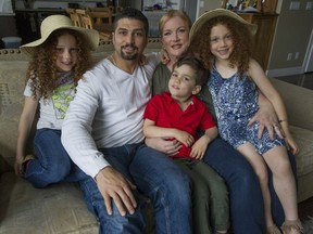 Ahmed Yousef is angered by the violence committed by ISIL, which he says is indiscriminately targeting people of several religions, including Muslims. Ahmed, second from left, is pictured at home with his family, from left, Safiya, 6, Adam, 4, wife Shelley and Layla, 6.