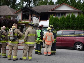 The aftermath of a house fire in Port Moody on July 10 in the 3300-block Dewdney Trunk Road. A GoFundMe page has been set up to help the six children left homeless after the blaze. Curtis Kreklau/PNG files