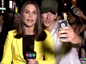 Vancouver police are investigating after a heckler interrupted a live broadcast to hurl sexually explicit remarks at a female reporter.