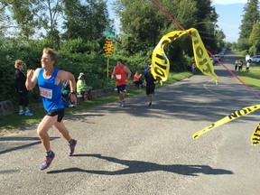 Ryan Prachnau of Abbotsford sprints to the finish line on Sunday for his third consecutive Fort Langley Half Marathon title. More than 300 runners and walkers took part in the morning event, hosted for the 13th year by Peninsula Runners of Langley.