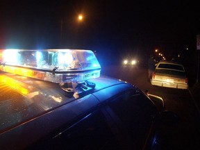 Emergency lights flashing on police car.