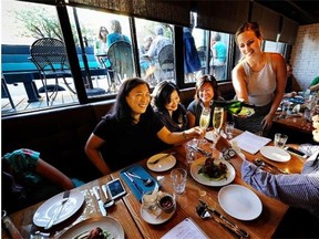 Sharing a meal during Dine Out Vancouver at Supermarine.