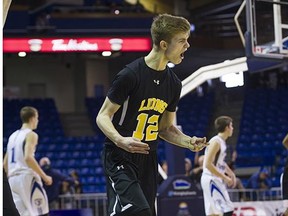 Ron Pettigrew's Garrett Tower celebrates after sinking a three-point shot against Credo Christian during the 2016 Boys 'A' High School Basketball Championships at the Langley Event Centre in Langley, BC, March, 12, 2016.