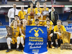 Kelowna Owls pose for a photo after defeating Tamanawis to win the 2016 Boys 'AAAA' High School Basketball Championships at the Langley Event Centre in Langley, B.C., March, 12, 2016.