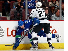 Step up, Linden Vey: The Canucks centre, here being pasted into the boards by L.A. Kings blue-liner Alec Martinez, will be a first-line centre tonight in place of the injured Henrik Sedin when the Canucks take on the host Kings at the Staples Center.