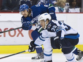 Chris Tanev, shown in action against the Winnipeg Jets last season, is expected to return to the Vancouver Canucks' lineup tonight. 'We wanted to get on a roll and it just hasn't worked for us,' he said. 'Hopefully we can get a third (straight win) tonight and get on that roll we've been looking for.'