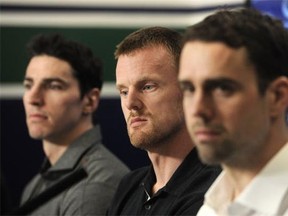 Alex Burrows, Danial Sedin and Dan Hamhuis talk to media as the Vancouver Canucks wrap up their unsuccessful season in Vancouver, BC., April 11, 2016.