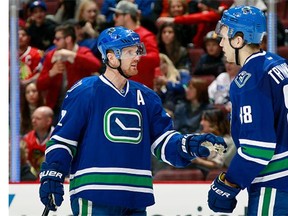 Alexandre Burrows #14 of the Vancouver Canucks is congratulated after scoring against the Chicago Blackhawks during their NHL game at Rogers Arena March 27, 2016 in Vancouver, British Columbia, Canada. (Photo by Jeff Vinnick/NHLI via Getty Images)