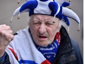 A Leicester City fan poses for a picture outside the stadium before the English Premier League football match between Leicester City and Swansea at King Power Stadium in Leicester, central England on April 24, 2016.