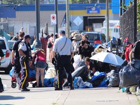 Surrey RCMP and bylaw officers swooped down on a Surrey homeless camp.