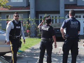 Integrated Homicide Investigation Team (IHIT) on the scene of a fatal shooting at 14300 block of 90A Ave, in Surrey, B.C., July 24, 2016.