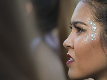 A woman listens as Gallant performs at FVDED in the PARK at Holland park in Surrey on July 2, 2016.